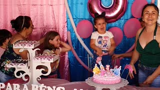 Sisters Fighting to Blow Out the Birthday Candle