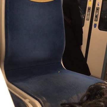 Headphones girl dances on subway car waiting for doors