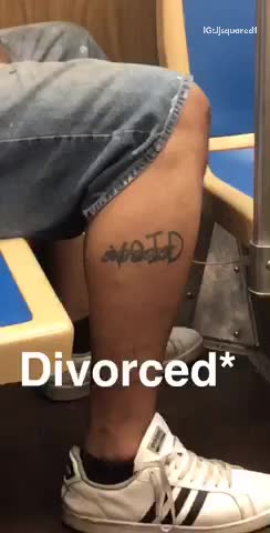 Man with divorced and void tattooed on leg is asleep