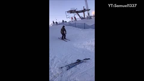 Black helmet snow ramp skiing backflip faceplant