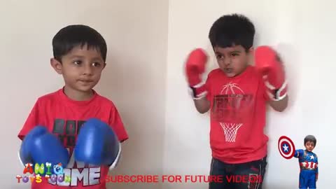 KIDS BOXING GLOVES REVIEW VIDEO - ANIQ TRIES ON PUNCHING GLOVES FIRST TIME!