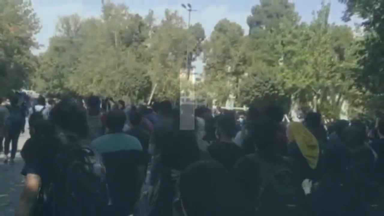 Iranian students holding a protest rally at the University of Tehran, chanting Death to Dictator