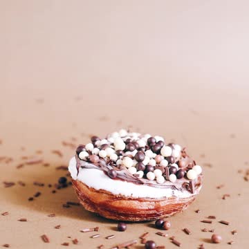 Sprinkling Toppings Over a Donut #shorts