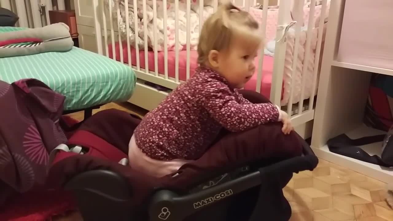 Maroon carseat baby faceplant