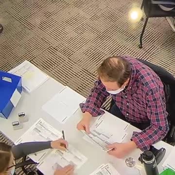 Poll worker in PA is FILLING OUT ballots for Biden.