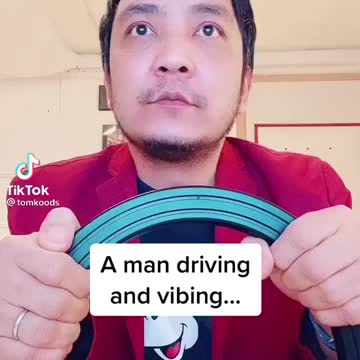 A man driving and vibing