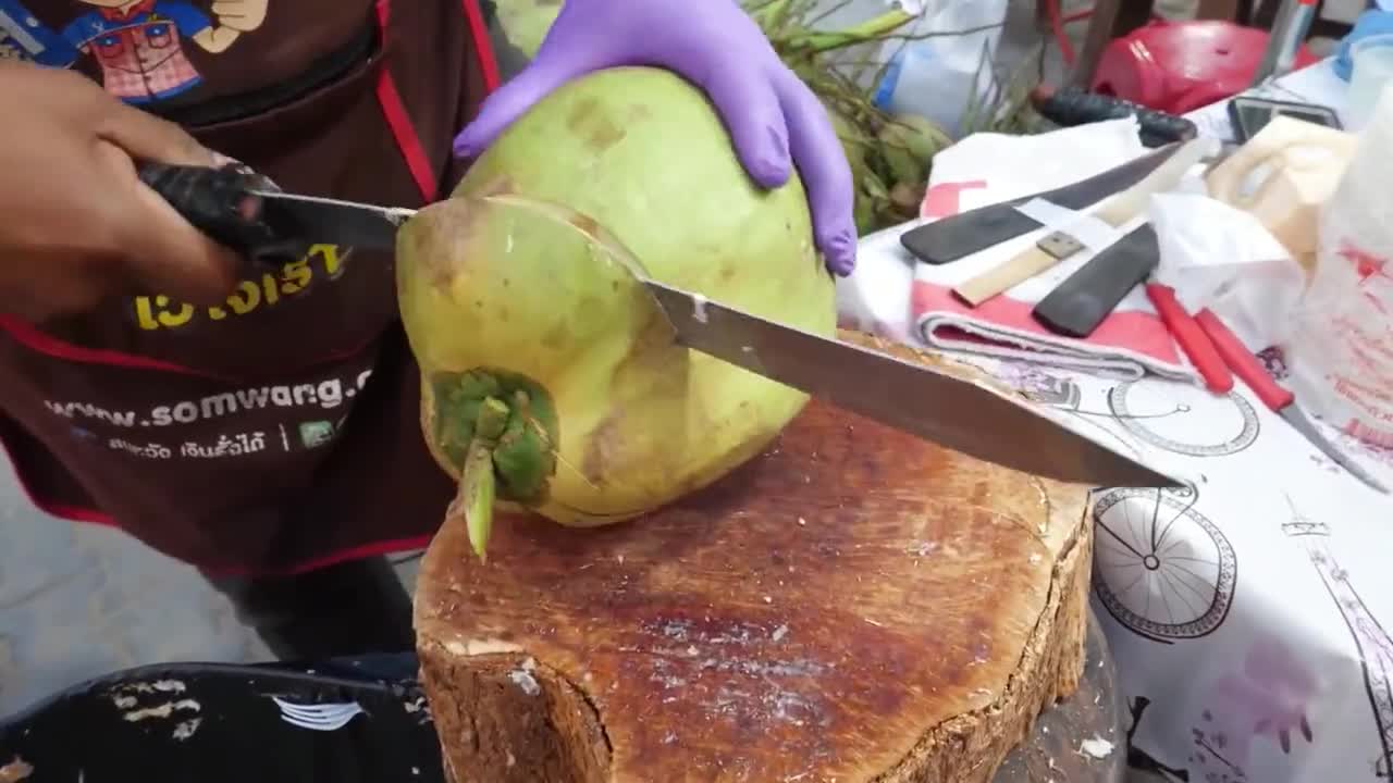 The coconut cutters on the streets of Thailand are really amazing