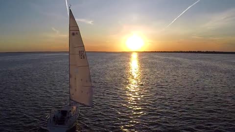 Drone captures spectacular footage of calm ship with sun horizon