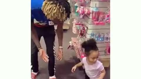 Little cute baby proves stubborn in a mall