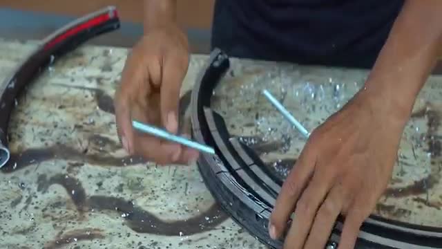 This Guy makes a Cool Bow out of Scrap Bicycle Rims