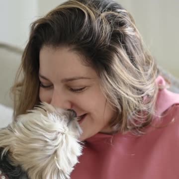 Woman Playing with a Dog