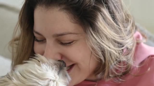 Woman Playing with a Dog