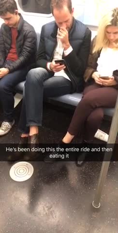 Man in blue jacket picks nose eats boogers