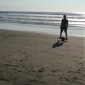 Riding one wheel board on beach