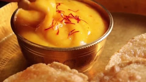 "The Irresistible Delight: Aamras Puri - A Divine Pairing of Mango Puree and Fluffy Deep-Fried Bread!"