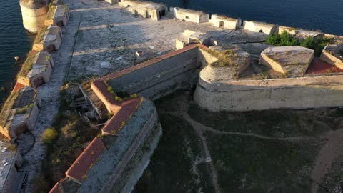 A real shot of a strange building in the middle of the sea