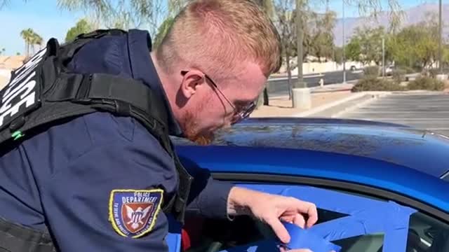 Police officer uses tape to open window!