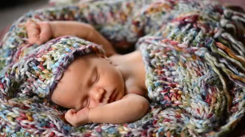 Newborn baby sleeping on his back