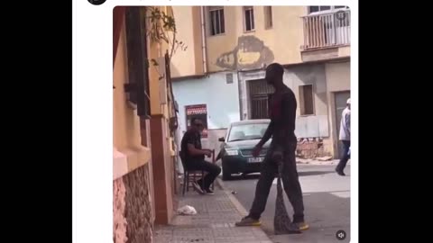 This is Spain. Why does no one help the woman?