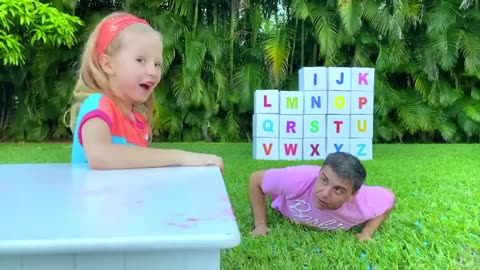 Nastya and Dad open the boxes with surprize to learn alphabet