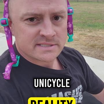 Unicyclist Walks Dog in a Heel