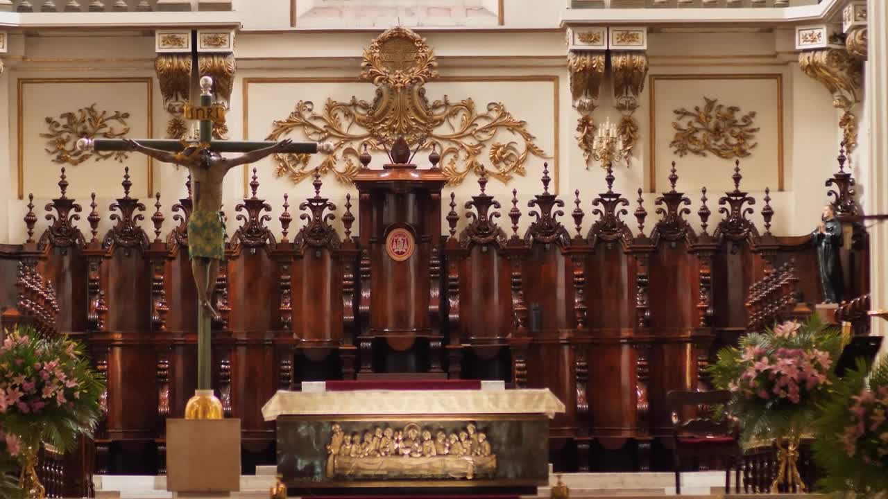 Altar the front of the interior of a church detailed with gilding