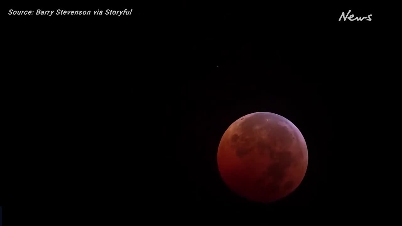 Moon shines blood red in total lunar eclipse