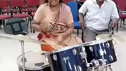 Girl playing drum