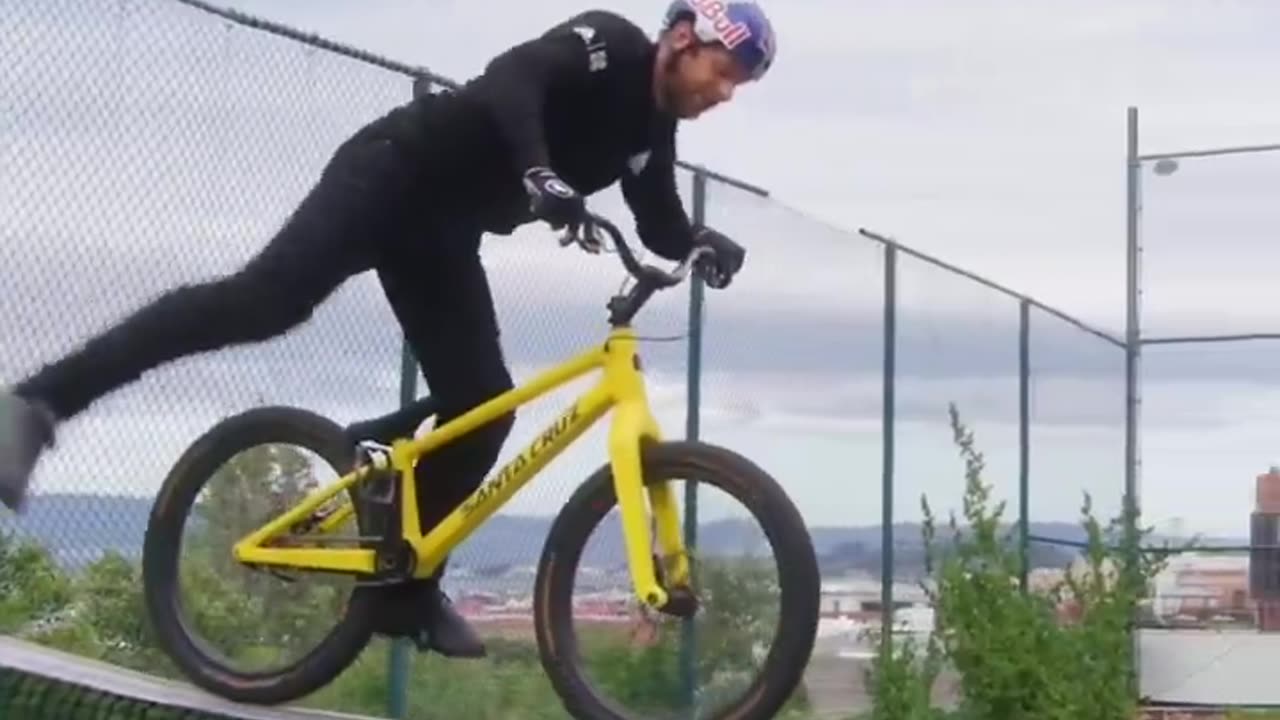 Guy Rides Bike On Tennis Net