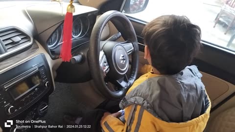 Cute baby driving car