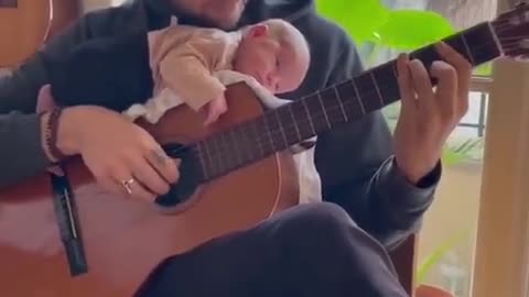 Small baby enjoy music