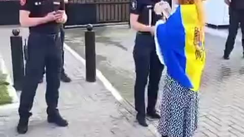 Pro-Ukrainian protestors pour water at the Russian Embassy in Moldova