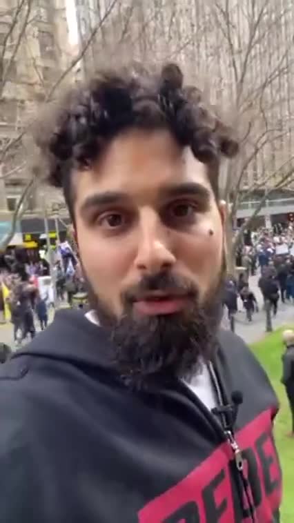 CROWD PUSHES THROUGH POLICE LINE