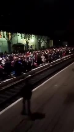 Ukrainian families are waiting for a train in Lviv to escape to Poland.
