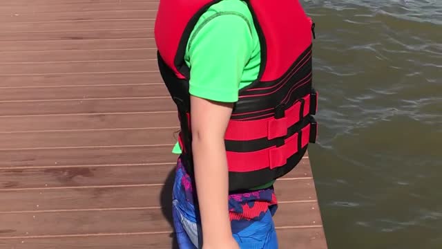 Kid Tries to Hype Himself Up to Jump Off Dock