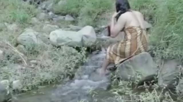 prank woman bathing in the river 🤣🤣🤣 thought to be a girl..thought to be a girl...🤣🤣🤣🤣