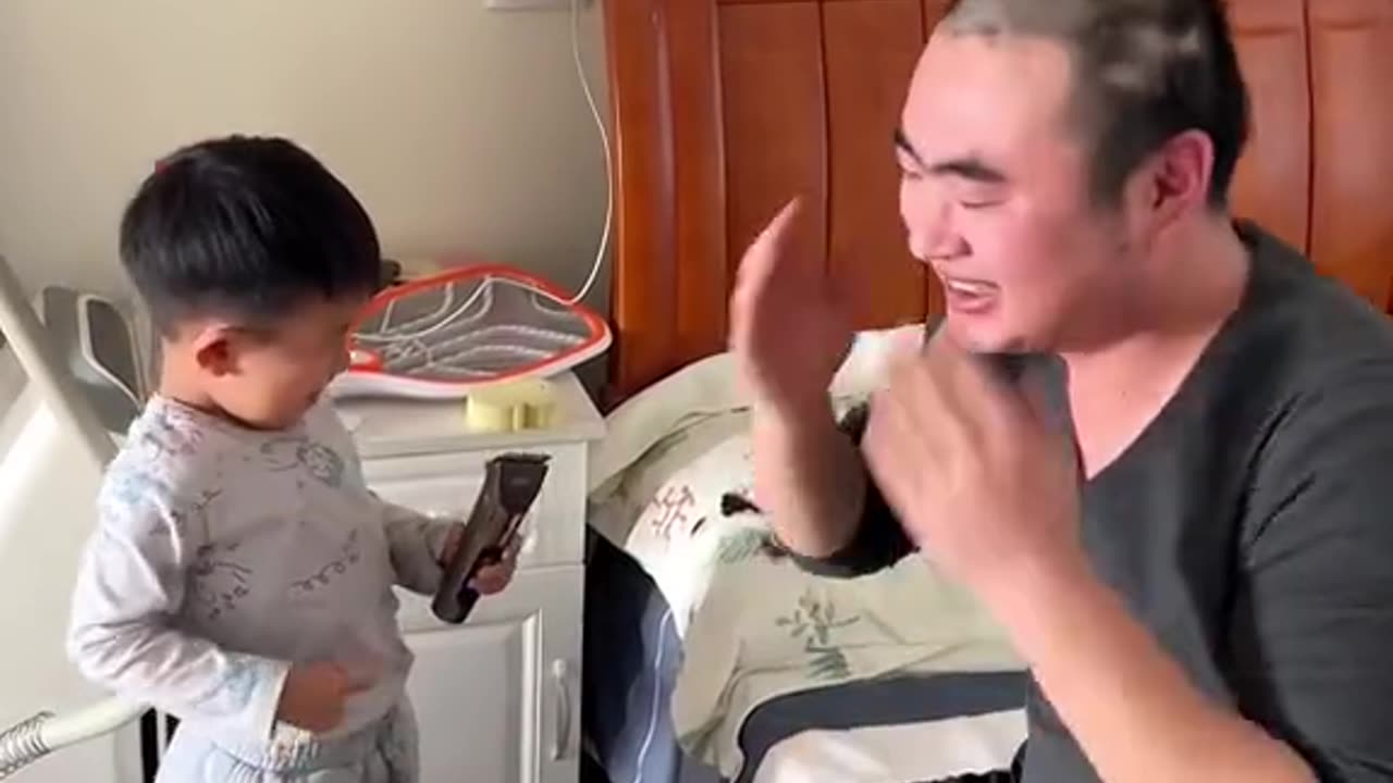 Cute baby playing with father