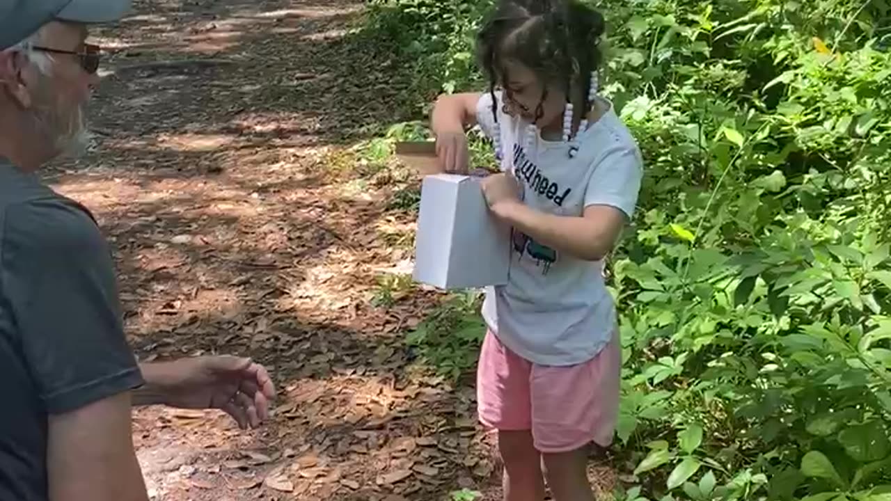 Jasmine receives cup from papa