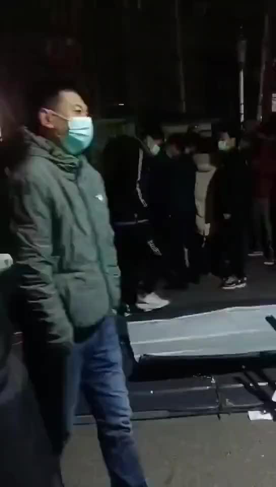 In Beijing, the people tear down fencing put up around businesses.