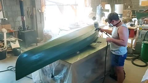 Adding a base green onto the canoe pre camo!