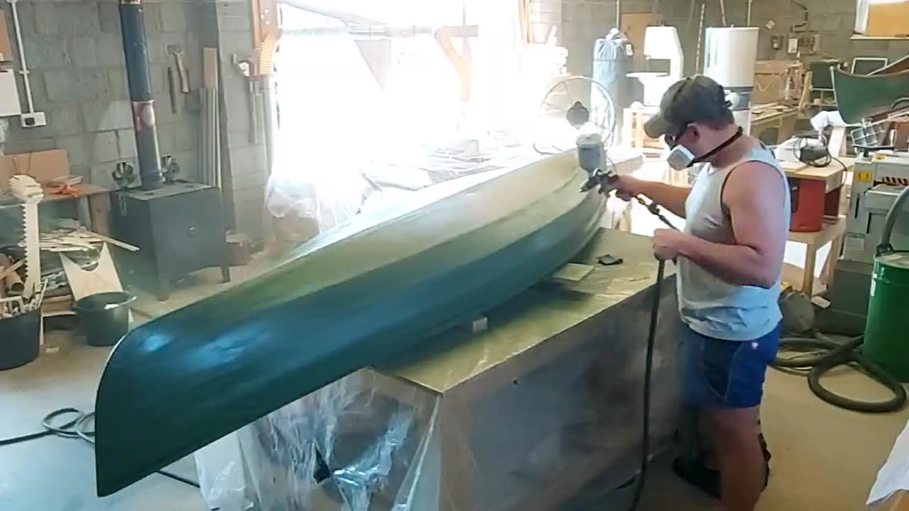 Adding a base green onto the canoe pre camo!