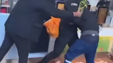 London Security Guard putting in a good shift. Knock those M***** Out!!