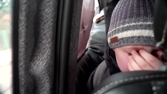 'We left our Dad in Kyiv' -little boy chokes back tears