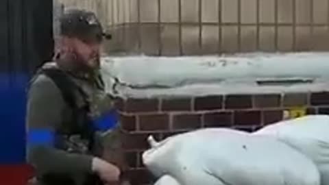 AFU troops remove the Russian sign on the police building in Lyman