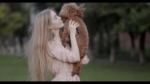 girl playing with cute puppy