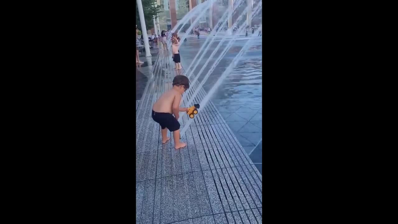 Clever kid uses water fountain to make his toy fly