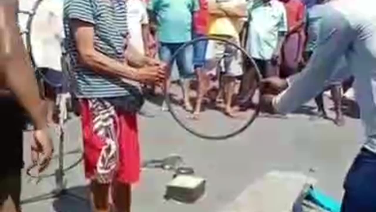 How the hell this huge guy dived through that small ring