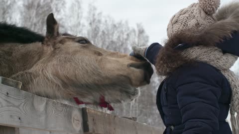 a girl touching the nose