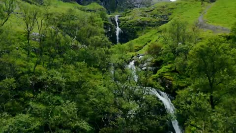 Aerial Drone Shot of Downhill Stream and Waterfall in Glen Coe