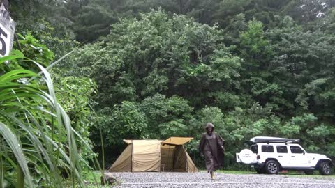 In a never-ending downpour, cozy solo camping in a shelter